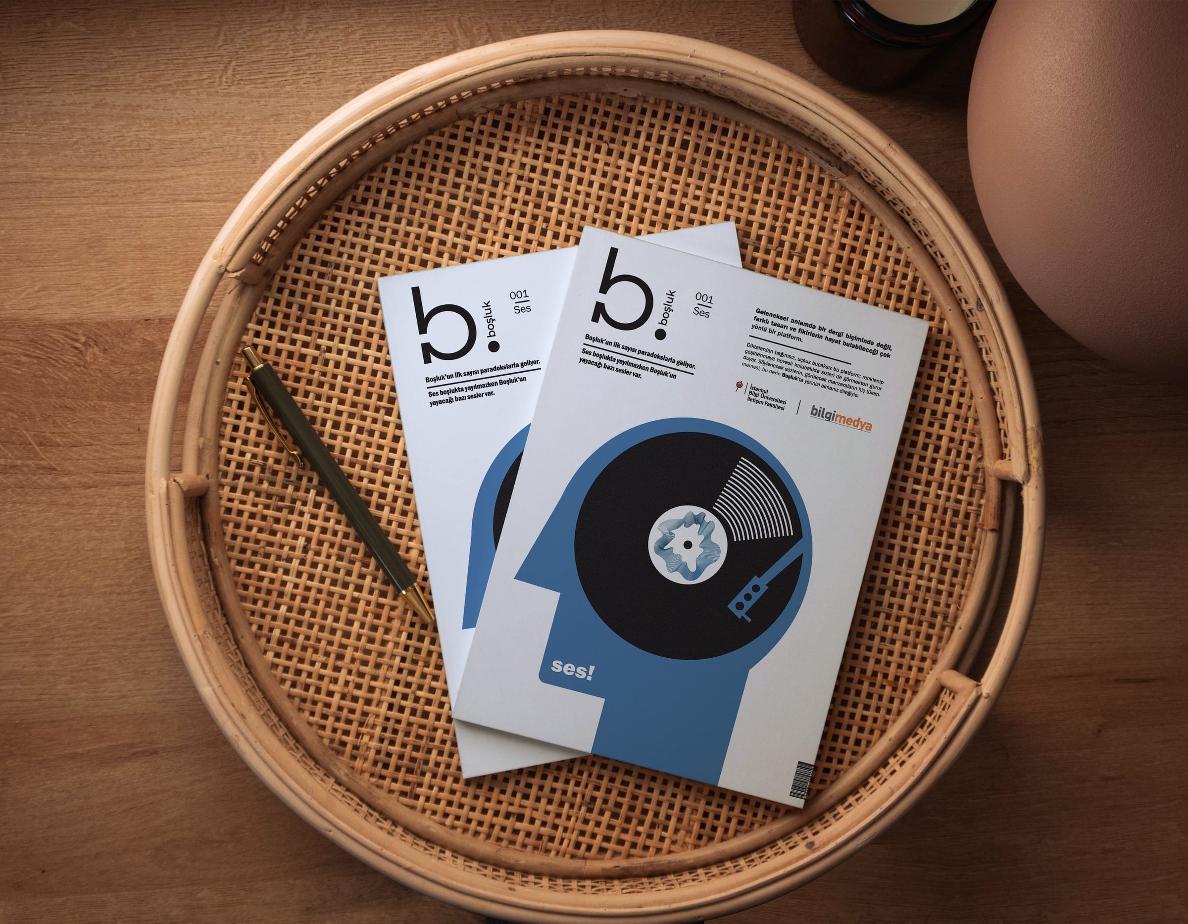 Two copies of the Boşluk magazine arranged on a woven tray, showing cover and partial spine detail.