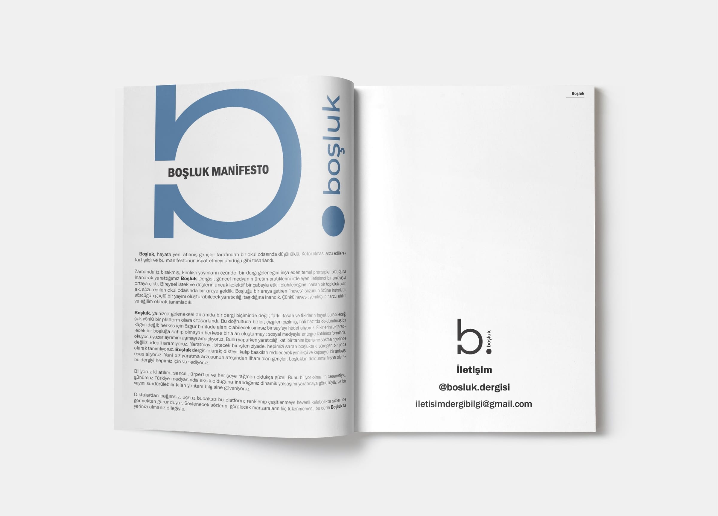 Manifesto spread with large blue logo mark and short manifesto text facing it.