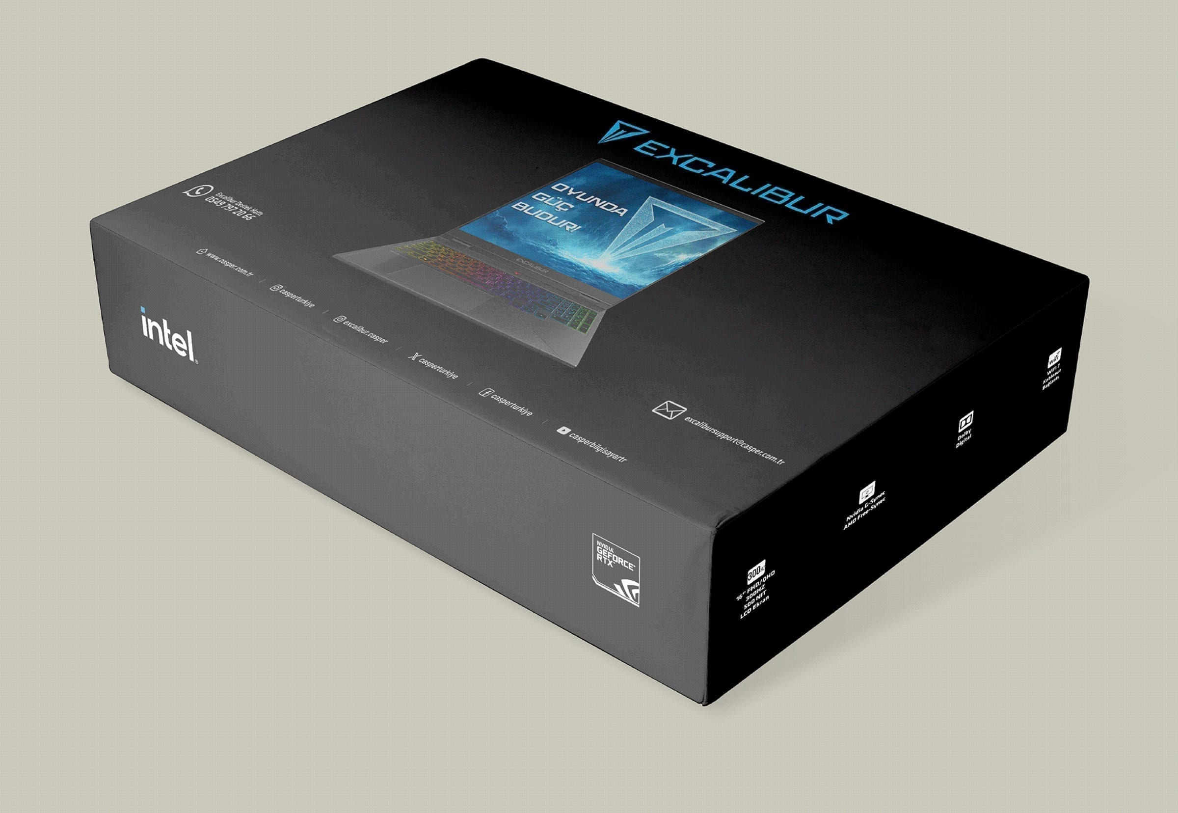 Excalibur G920 gaming laptop box on a neutral surface, showing dark packaging with gaming brand graphics.