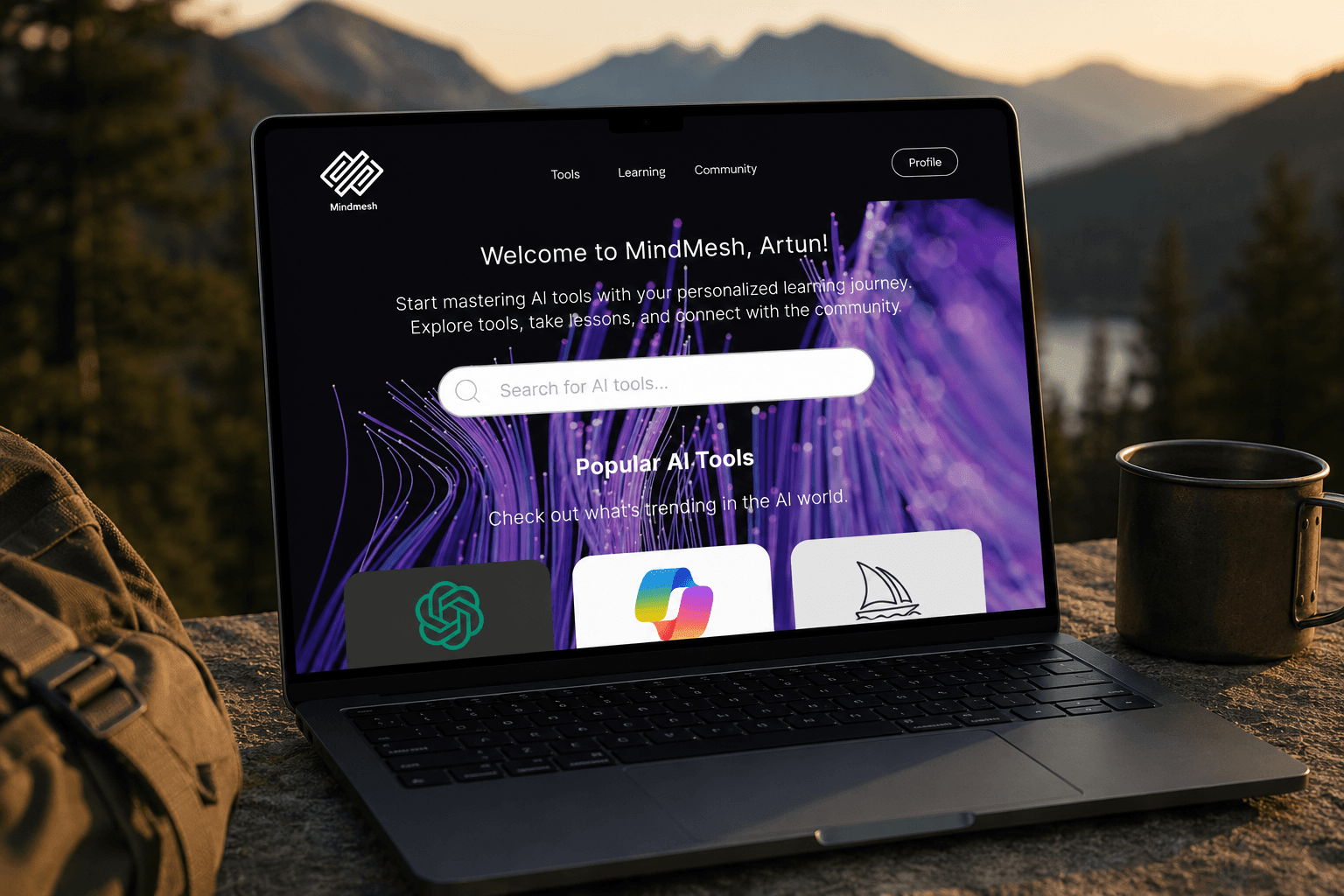 MindMesh dashboard screen on a MacBook Pro in a mountain landscape setting, showing the welcome screen with Popular AI Tools and Your Learning Path sections.