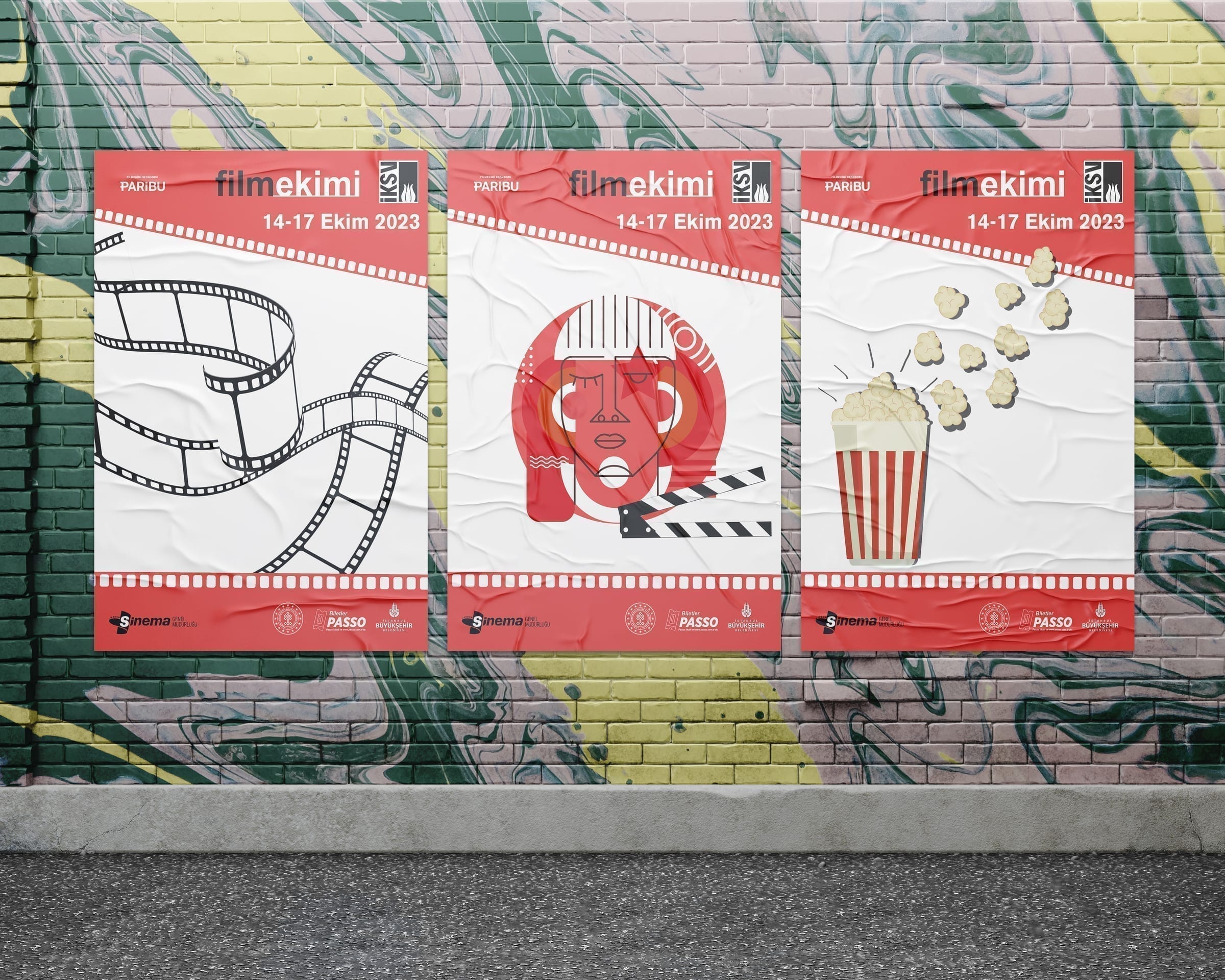 Posters installed on an outdoor street-art wall in Istanbul.