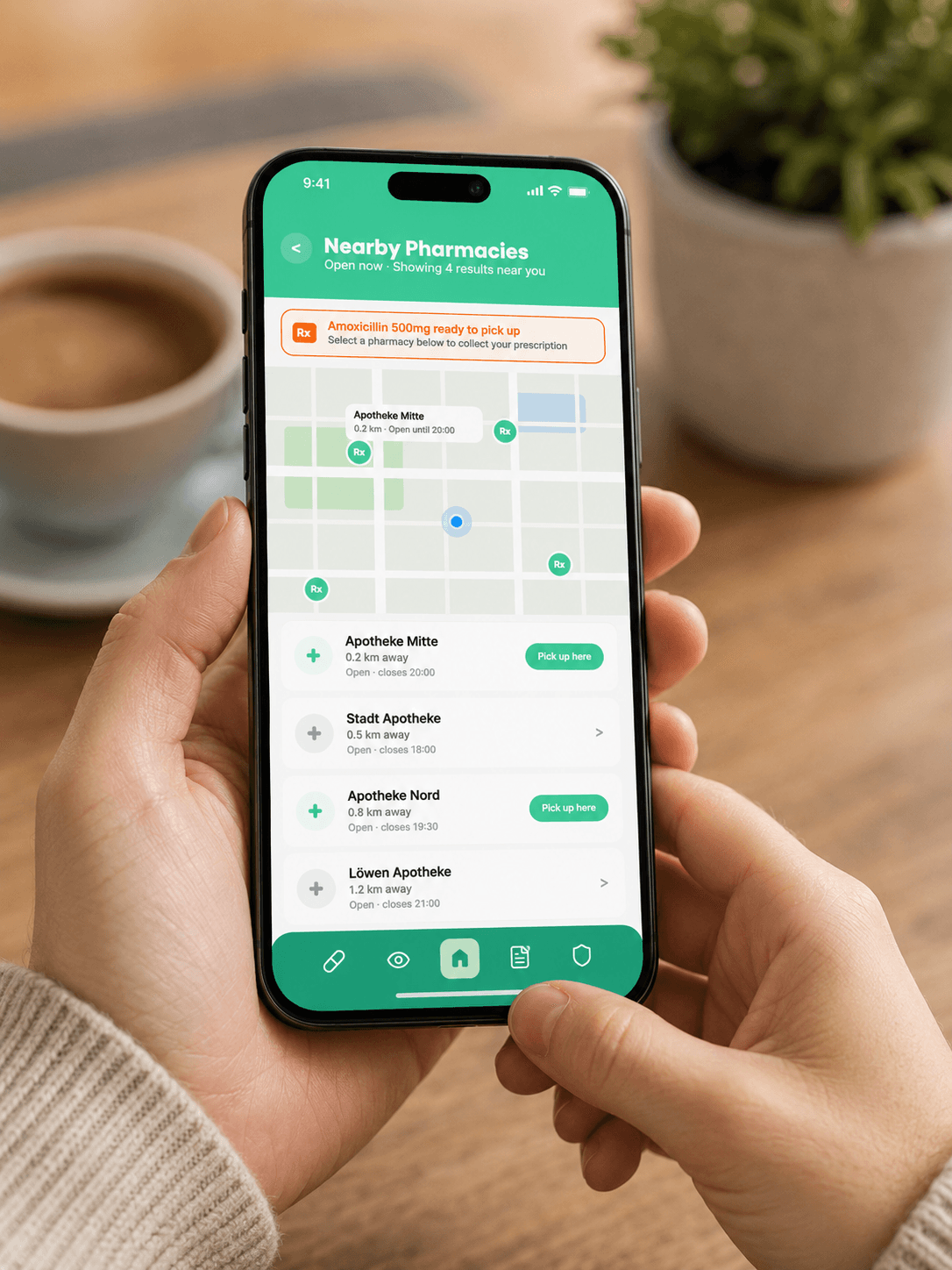 MedPass nearby pharmacies mockup on a phone held in both hands, showing map and pickup options.