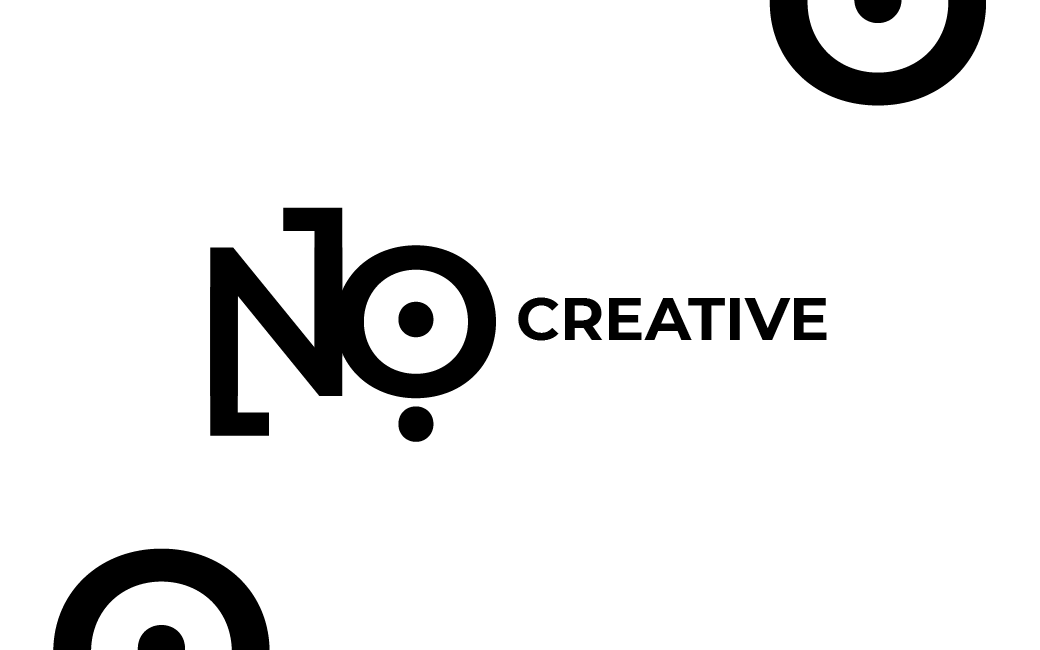 NO:118 Creative business card front, logo centred with decorative circle motifs in corners.