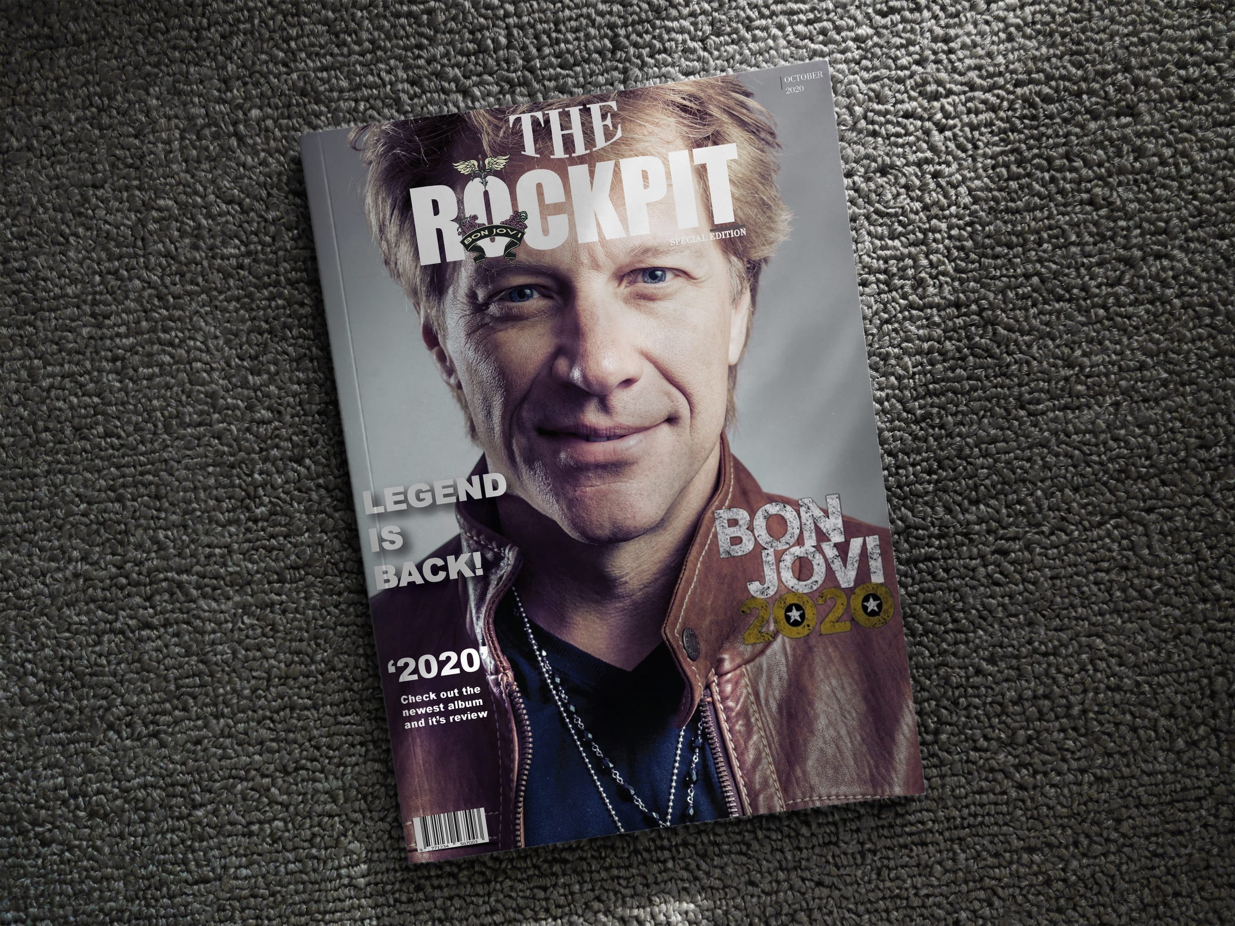 Multiple issues of The Rockpit magazine stacked on a woven surface.